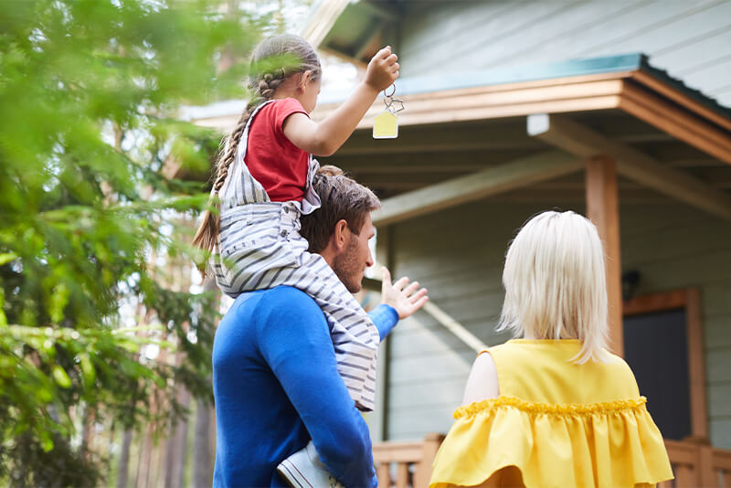 Family arriving at new house